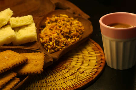 Evening cup of tea with cookies and namkeen yummy snacky timeの写真素材