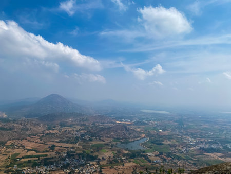 view of the city from the top of the mountain cloudy sky building lake beautiful landscapeの写真素材