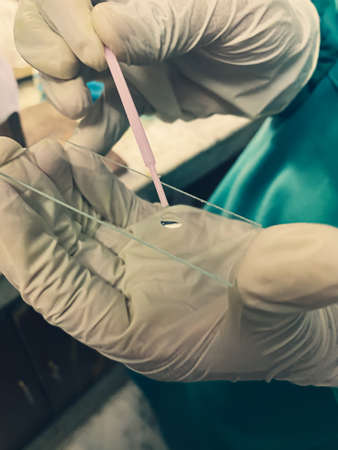 surgeon holding surgical instruments in surgery for testing the sampleの写真素材