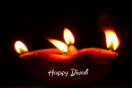 Happy Diwali diya glowing oil lamp heart shaped candles Indian Festival greeting wishesの写真素材