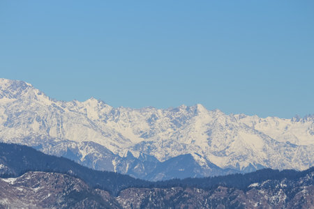 snow covered mountains in winter with clear blue sky nature landscapeの写真素材