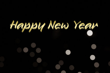 Golden Happy New Year with black dotted bokeh backgroundの写真素材