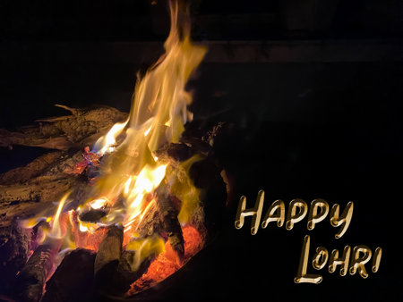 Happy written on a fire in a campfire at nightの写真素材