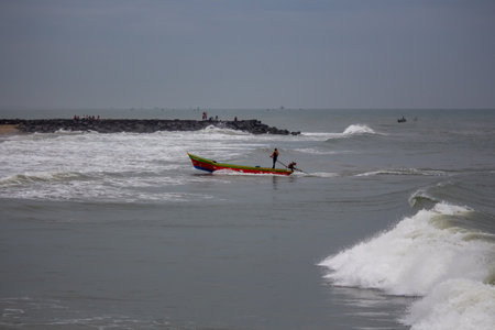 fishing in the  boats on the high waves tides  beach landscape sceneryの写真素材
