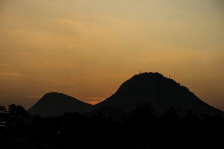 silhouette view of mountains with a beautiful sunset sky landscape sceneryの写真素材