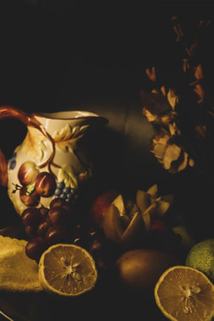 Still life with fresh healthy juicy fruits on a dark background. Vintage style posters.の写真素材