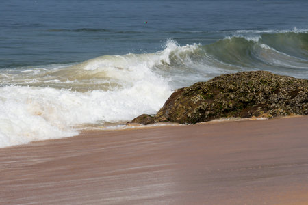 Waves breaking on the beach on the coast of  Gokarana, India. Splashy wavy background wallpaperの写真素材
