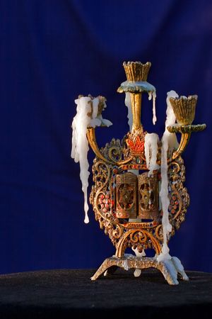 
Candlestick with remaining of candles on blue background  

の写真素材