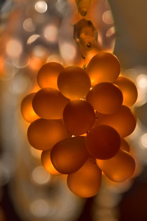 Cluster of crystal pendants on a chandelier, lit from insideの写真素材