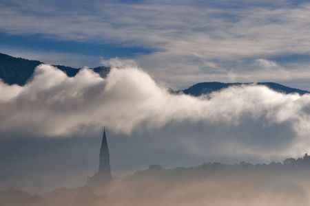 Tower of an antique fortress wall surrounding the townの写真素材