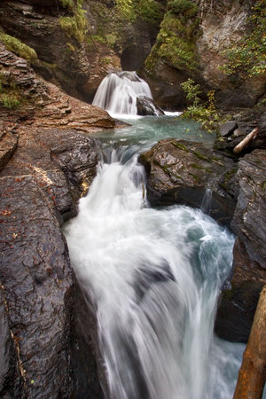  A rough mountain falls among rocks and woods