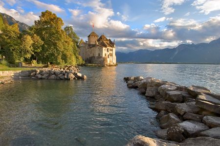 A medieval fortress ?hillon on lake Leman on a sunsetの写真素材
