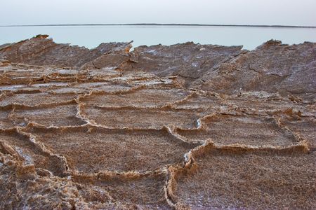  A shallow in the Dead Sea, covered by the evaporated saltの写真素材
