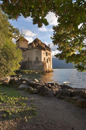 A medieval fortress ?hillon on lake Leman on a sunsetの写真素材