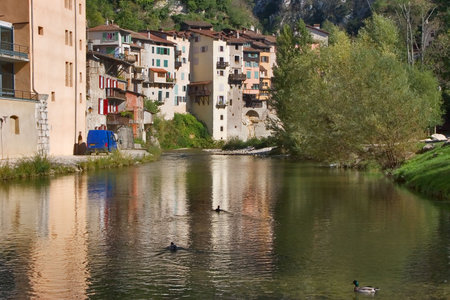  The medieval city constructed on rocks about the mountain riverの写真素材