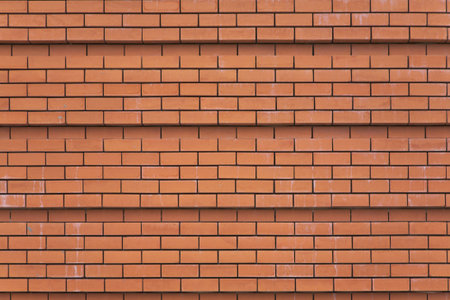 Wall of a cathedral ideally laid out by red bricks in Madrid