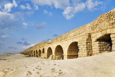 Perfectly kept aqueduct of the Roman period at coast of Mediterranean sea in Israelの写真素材