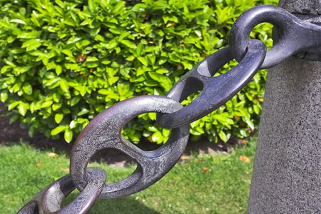 Massive metal circuits and concrete curbstones on edge of sidewalk in Madridの写真素材