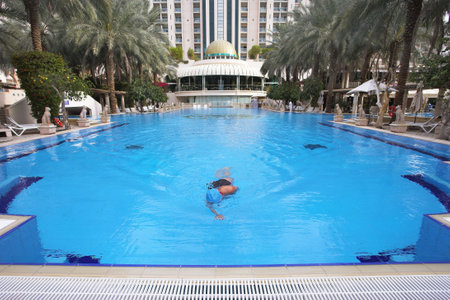  Morning training of the girl in magnificent poolのeditorial素材