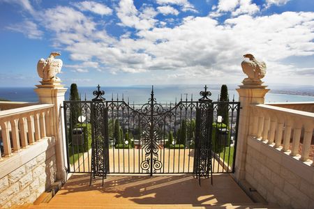 Charming architectural ensemble in Bahai gardens: a survey ground from a red marble and graceful black iron-barredの写真素材