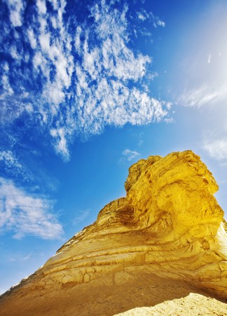 Freakish hills from the sandstone, reminding a head of a sphynx, in dry desertの写真素材
