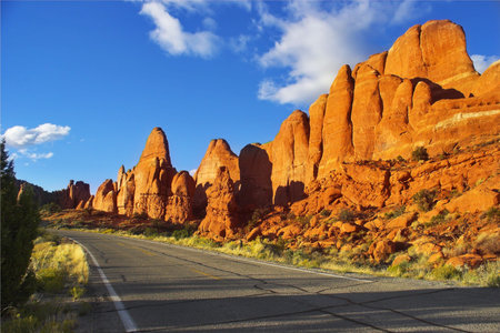 Magnificent road among freakish natural stone formations in the well-known park in the USA archの写真素材