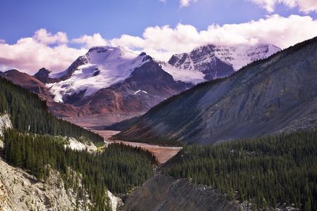 Majestic mountain landscape, glaciers and the snow slopes shined by the sunの写真素材
