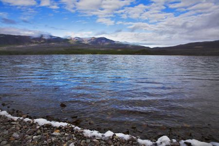 Ripples on water of superficial northern mountain lakeの写真素材