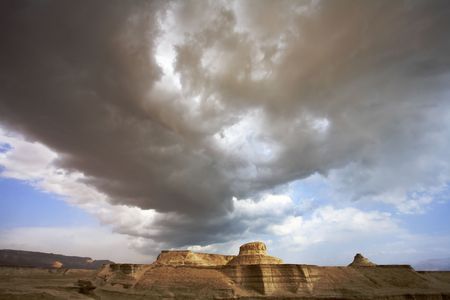 Huge cloud of the freakish form above stone desert. Spring in Israelの写真素材