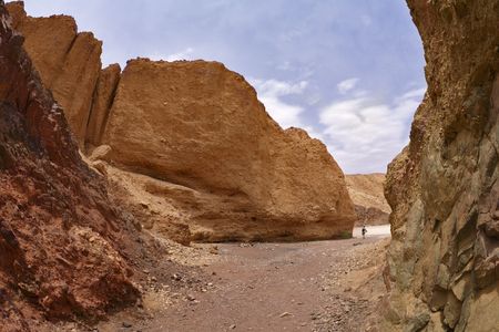 The lonely woman-tourist in the Black canyon in desertの写真素材