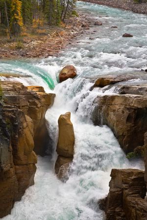 The rapid current. A falls in a narrow and deep canyon in the north of Canadaの写真素材