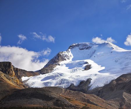 Majestic mountain landscape, glaciers and the snow slopes shined by the sunの写真素材