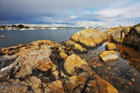 Stony coast of passage which separates island Vancouver from Pacific oceanの写真素材