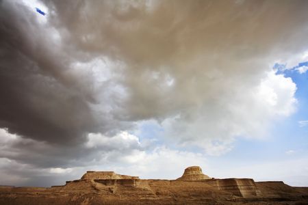 Huge cloud of the freakish form above stone desert. Spring in Israelの写真素材