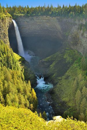 A powerful picturesque falls shined by the sunの写真素材