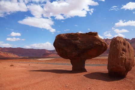 Grandiose panorama - stone desert from red sandstone and the well-known rock in the form of a mushroom. Windy solar autumn dayの写真素材
