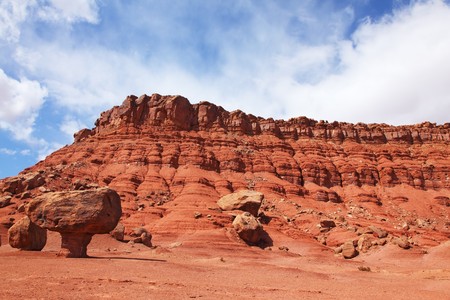 Grandiose panorama - stone desert from red sandstone and the well-known rock in the form of a mushroom. Windy solar autumn dayの写真素材