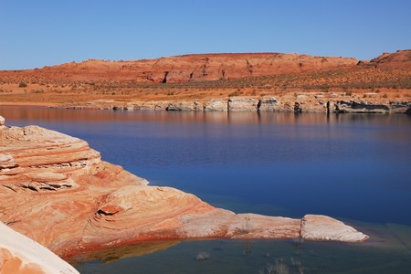 Antelope Canyon in the Navajo Reservation. The stone desert of red sandstone and bright blue waters.の写真素材