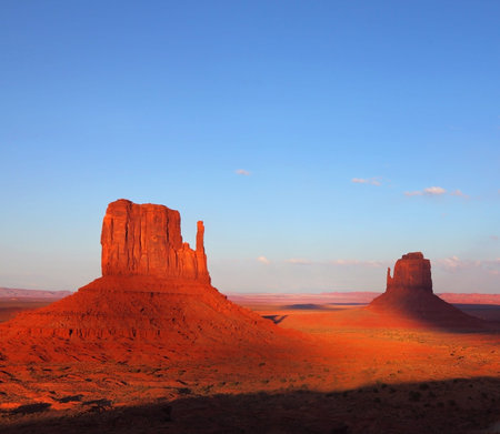 The famous "Mittens" in Monument Valley. The cliffs of red sandstone at sunsetの写真素材