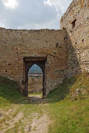 Barred gates and walls of the ruined medieval citadel in Slovakia.の写真素材