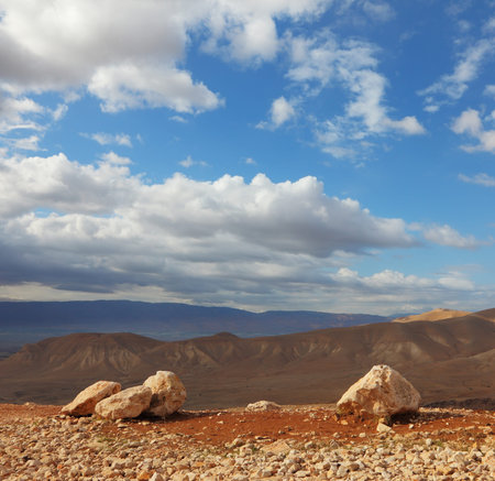 Magnificent transparent day in Judean desert. Huge boulders along highway, an unflawed skyの写真素材