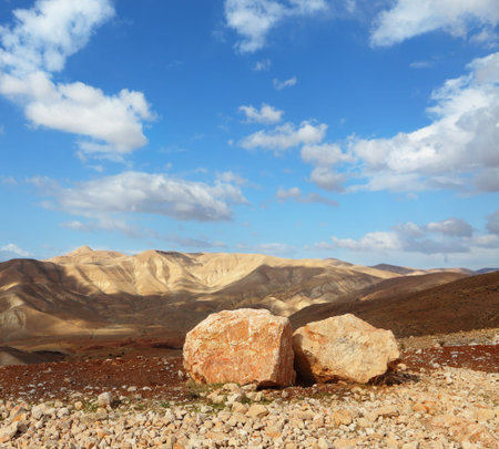 Magnificent transparent day in Judean desert. Huge boulders along highway, an unflawed skyの写真素材