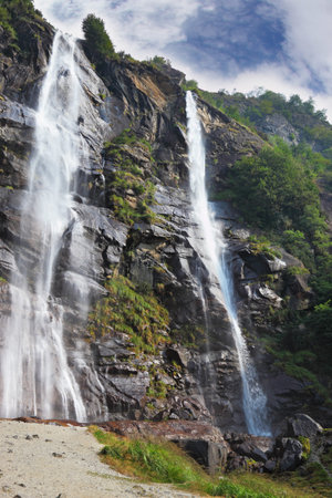Picturesque double waterfall in the mountains of Northern Italyの写真素材