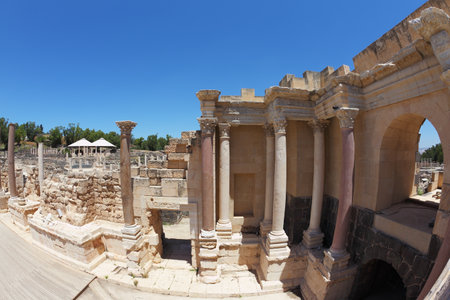 Stone columns and the scene in the Roman amphitheater at Beit Shean, Israelのeditorial素材