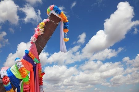 Beautifully decorated with colored silks Native Longtail boat is oriented in the skyの写真素材