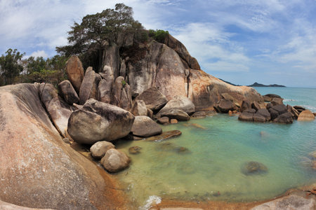 Picturesque coastal cliffs and azure sea. Koh Samui