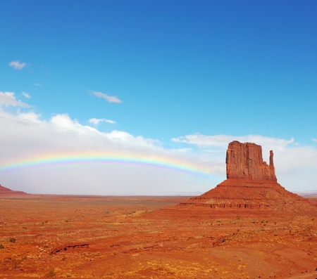 Rainbow in a red desert  Monument Valley in the autumn, after rainの写真素材