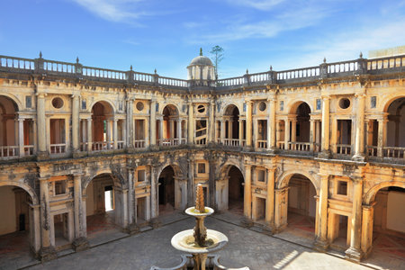 Beautifully preserved castle - palace of the Templars. Courtyard surrounded by galleries. In the center - a fountain. Portugal, Tomarのeditorial素材
