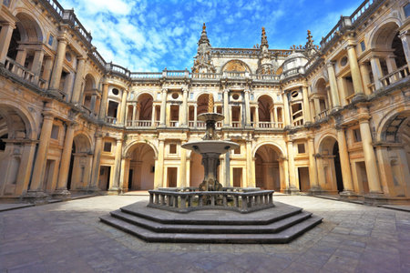Beautifully preserved castle - palace of the Templars  Courtyard surrounded by galleries  In the center - a fountain with a pool in the shape of a cross  Portugal, Tomarのeditorial素材