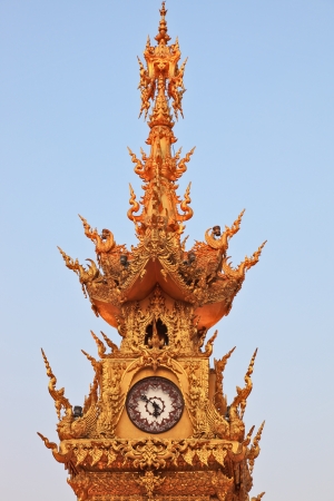 The gilded clock tower in the town squareの写真素材